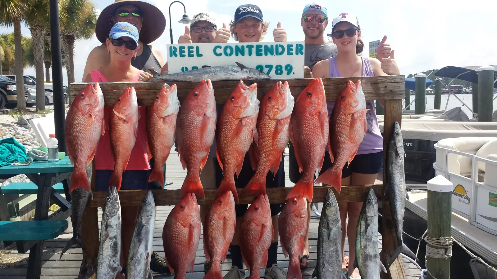 A fishing charter group with a large catch of red snapper